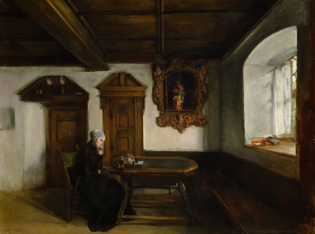 Woman seated in loneliness by a table