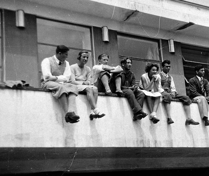 Bauhaus students on the Dessau Bauhaus cafeteria balcony, between 1931 and 33. Happy, young people on the Bauhaus Dessau cafeteria balcony in the 1930's