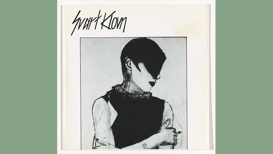 Dagfinn Knudsen, «Svart Klovn», 1983 Platecover med bilde av en person med svart lugg og svart overdel