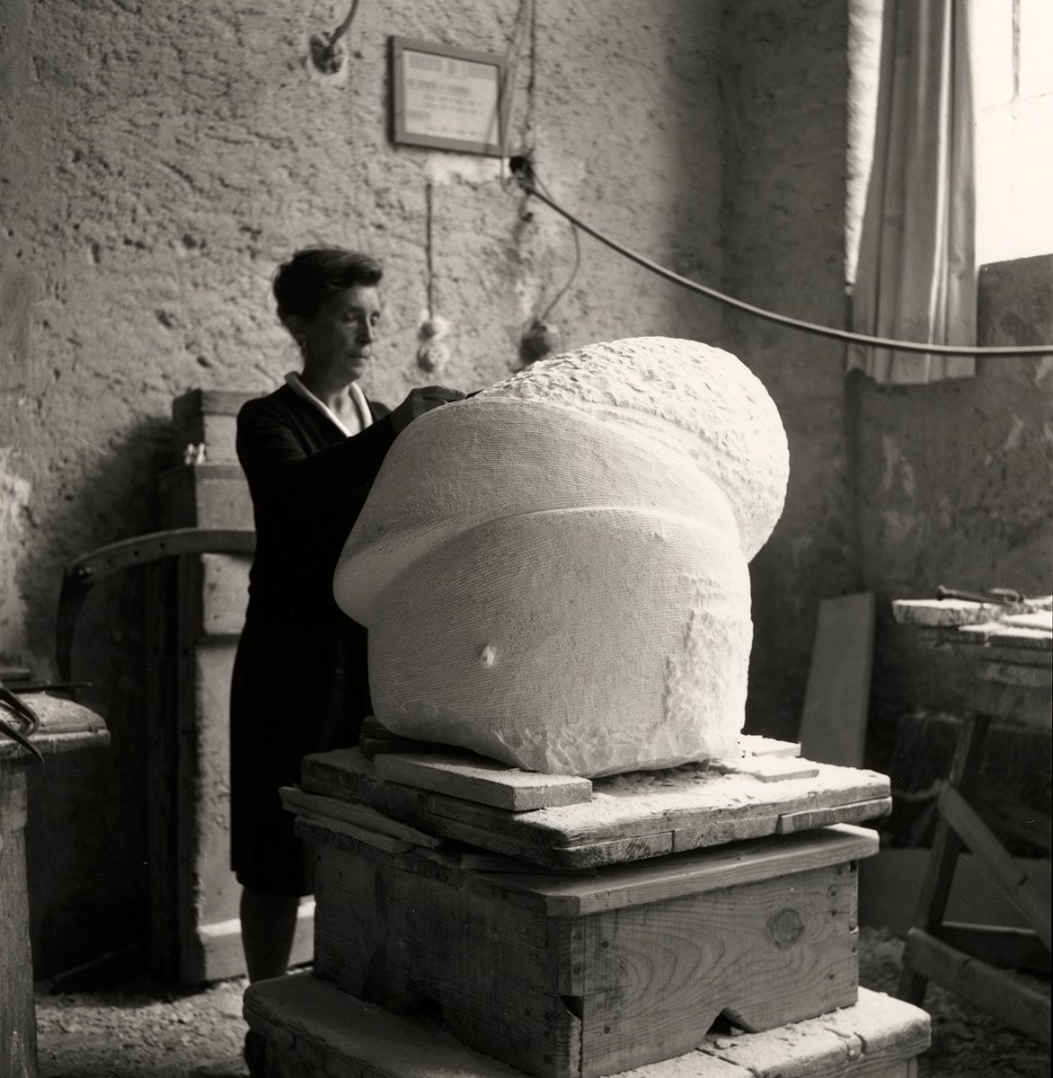 Woman working on sculpture