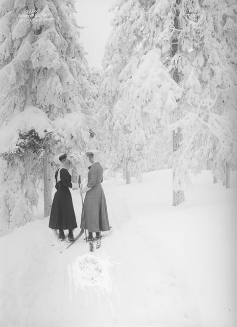 Skiing with her sister, Princess Victoria, 14 February 1907 two women skiing in snowy forest