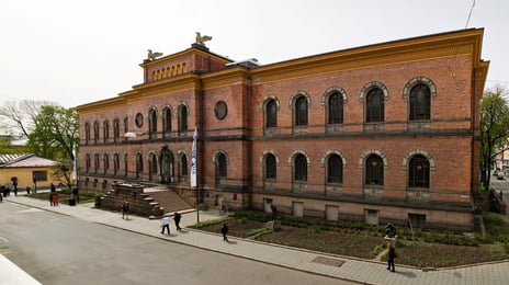 Front view of a red-bricked museum building