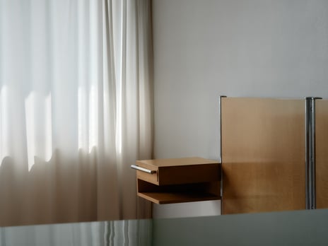 Photography of bed by a window