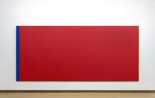 Barnett Newman, "Who's Afraid of Red, Yellow and Blue III", 1967-1968 A big canvas painted red mounted on a white wall. The canvas has a thin blue, and an even thinner yellow line in its edges.