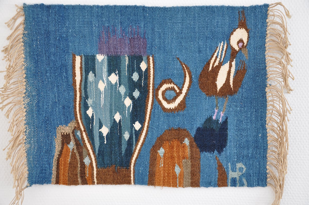 Blått vevteppe med fugl