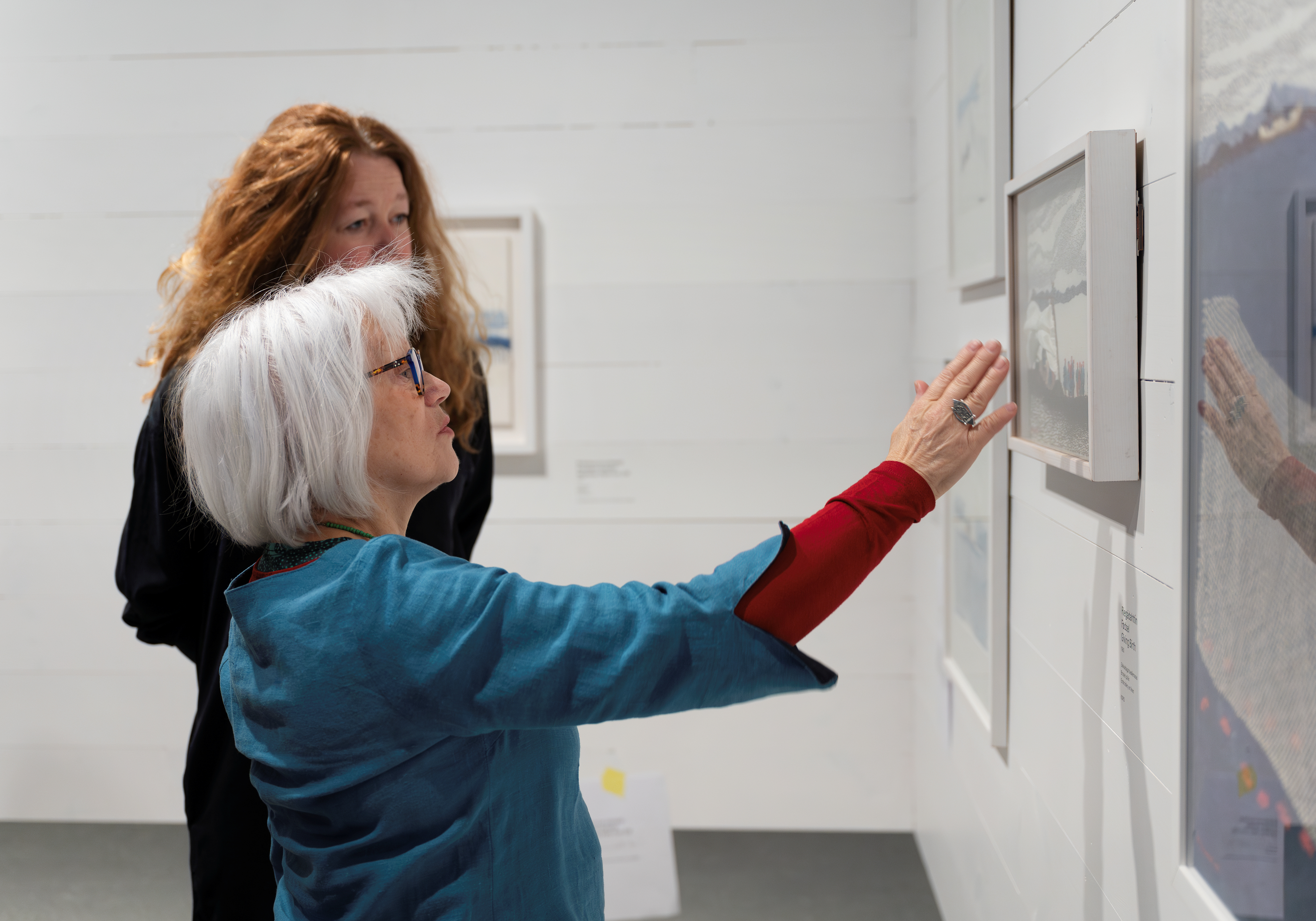 Artist Britta Marakatt-Labba and curator Anne Sommerin Simonnæs in the exhibition "Britta Marakatt-Labba. Moving the Needle".