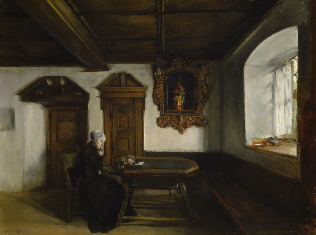 Woman seated in loneliness by a table