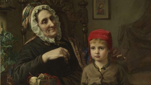 Maleriet viser en bestemor som har strikket en ny, rød lue til sitt barnebarn.