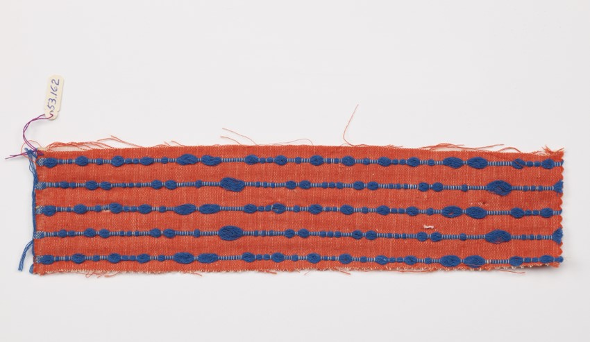 small piece of fabric, orange with blue stripes