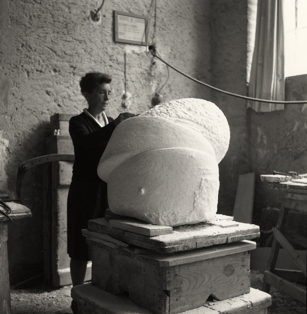 Woman working on sculpture