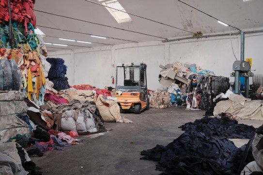 Formafantasma, manual selection of woollen rags at Francioni, 2022, Prato, Italy